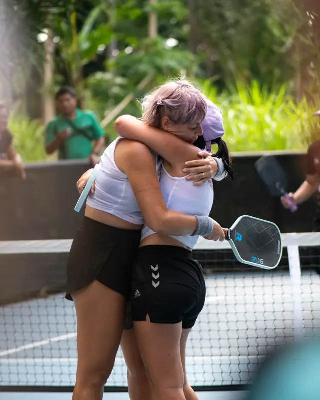 Teammates embracing after a stunning victory
